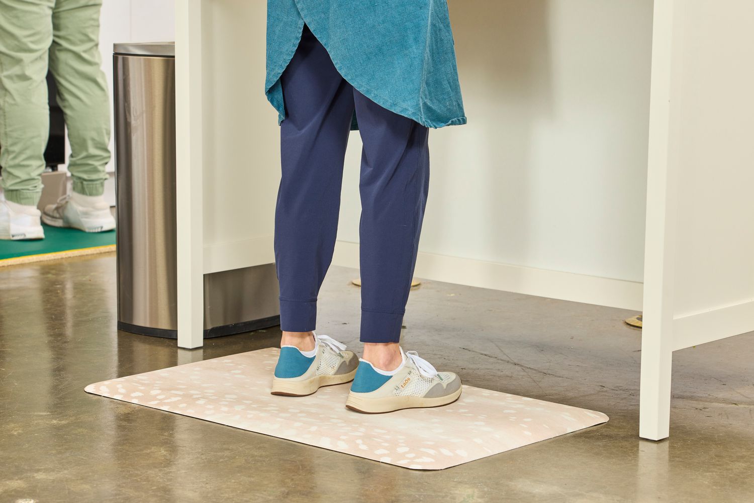 A person stands on The House of Noa Nama Standing Mat