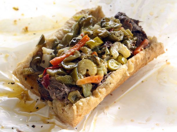 An Italian beef sandwich from Johnnie's Beef, a storied Chicago eatery. The bread is no match for the amount of beef, peppers, and giardiniera piled on it.