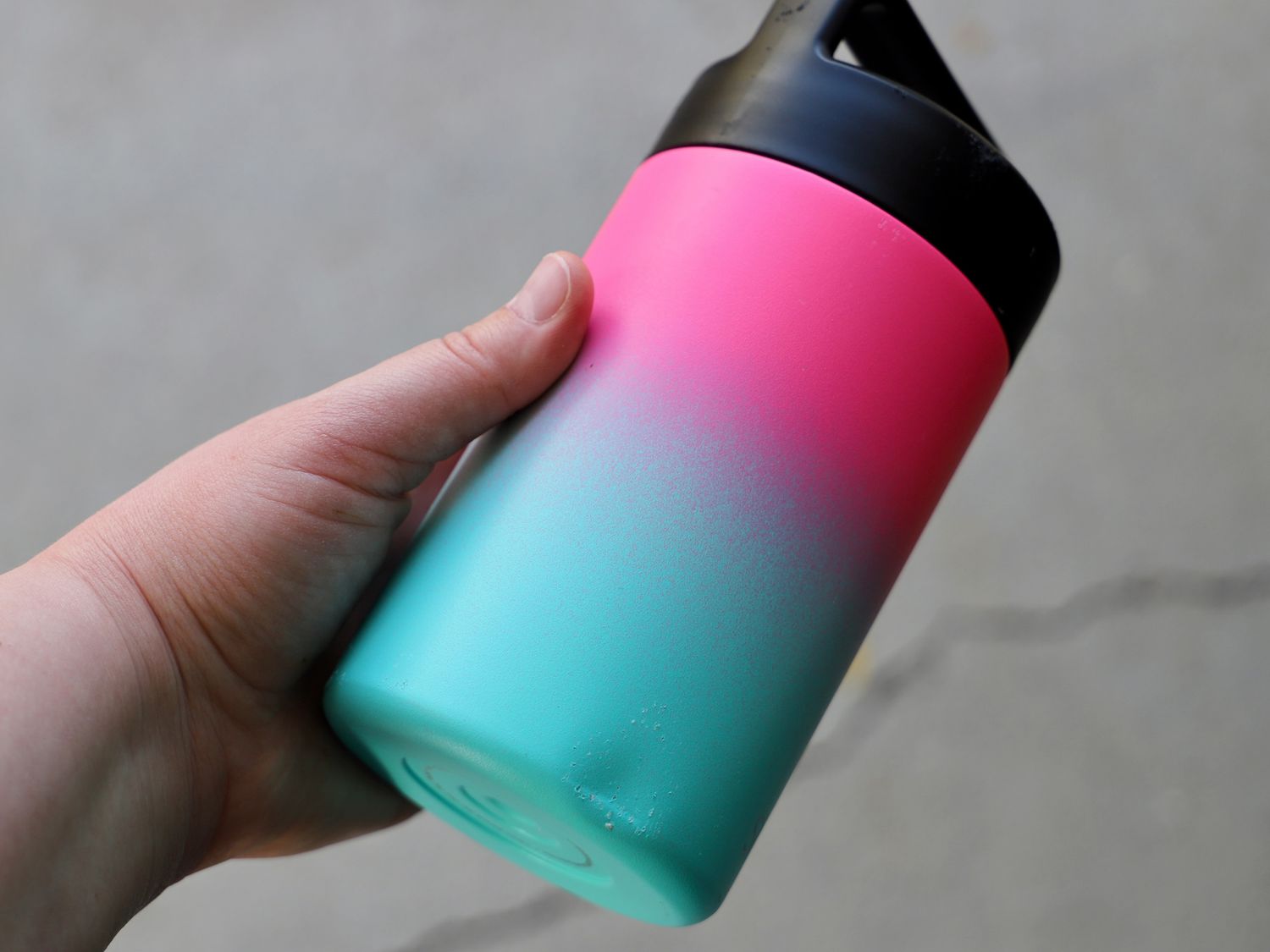 a person holding the simple modern thermos