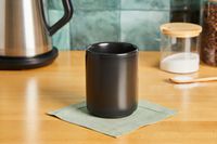 The Fellow coffee mug on a kitchen countertop.