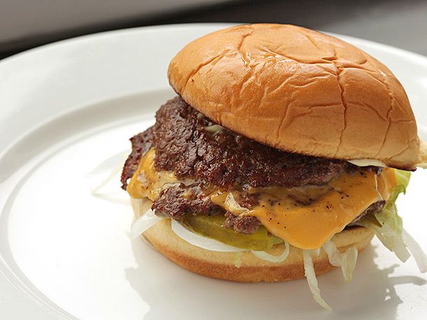 Ultimate Smash Cheeseburger with pickles, lettuce, and onion