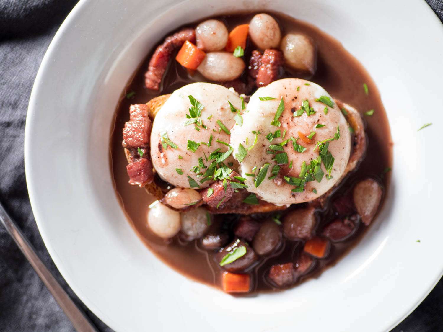 Overhead closeup of eggs en meurette.