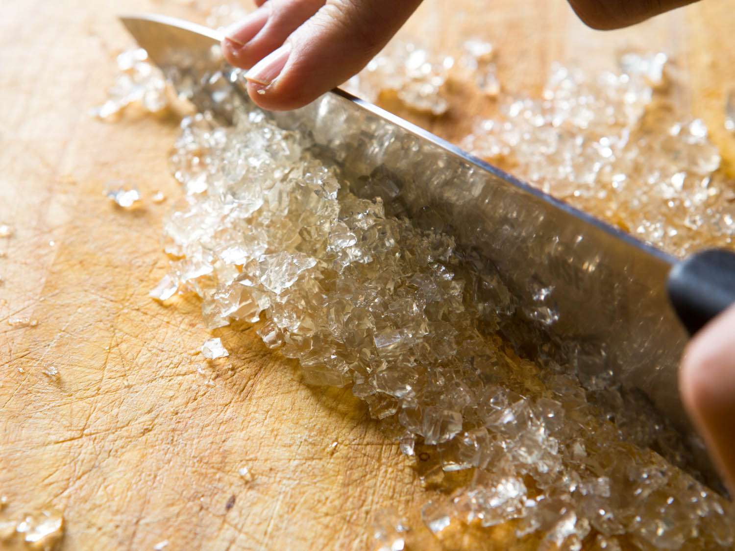 Mincing gelled stock for meatballs.