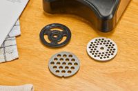 The different sizes of grinding plates of Cuisinart Electric Meat Grinder