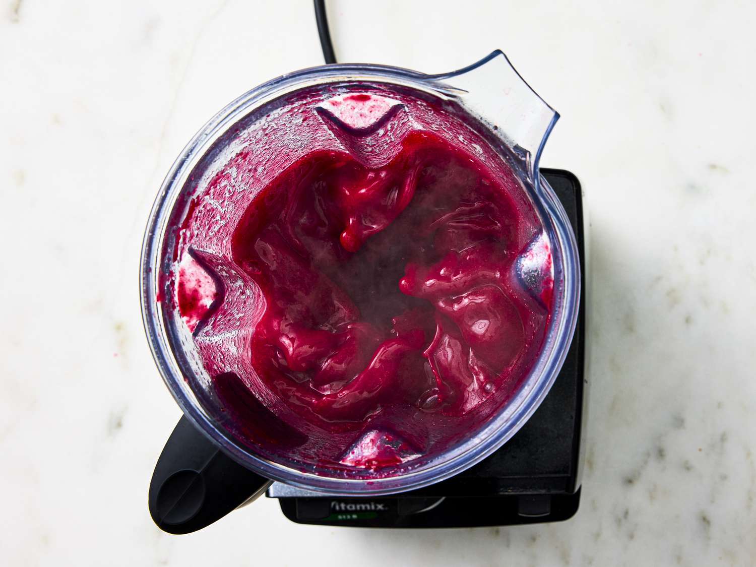 Beet and cherry soup mixture in blender