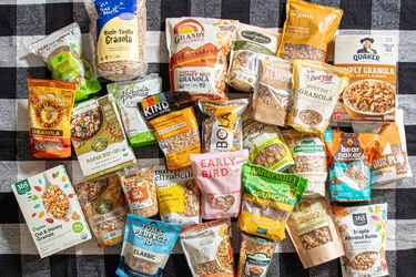 A selection of granola brands displayed on a checkered tablecloth
