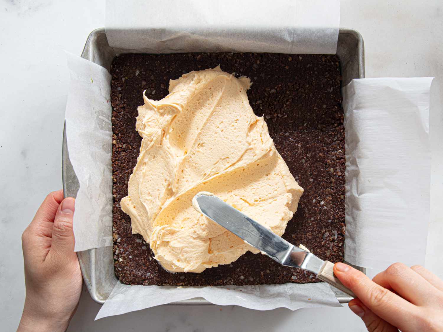 Overhead view of spreading cream