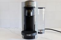The Nespresso VertuoPlus Coffee and Espresso Machine by De'Longhi on a kitchen counter