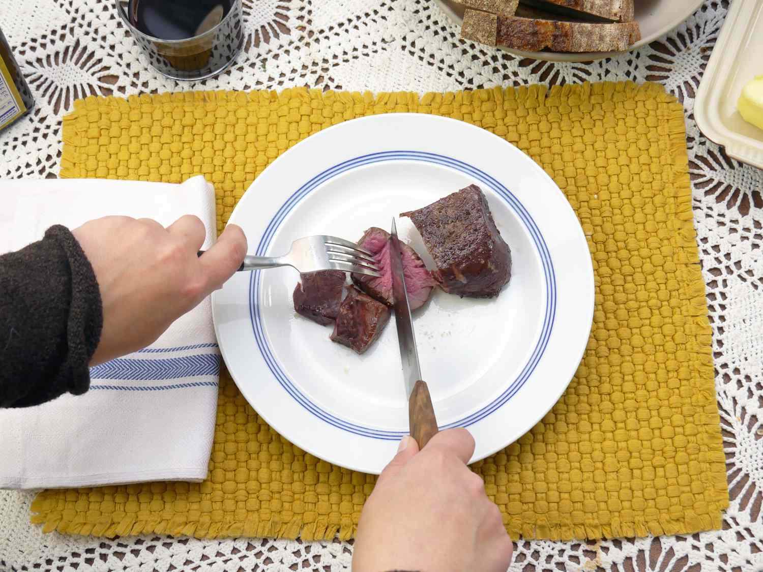 a person using the victorinox modern knives to slice steak 