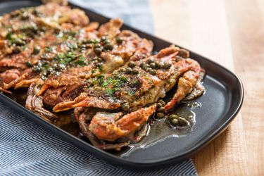 Four soft shell crab resting on a serving platter