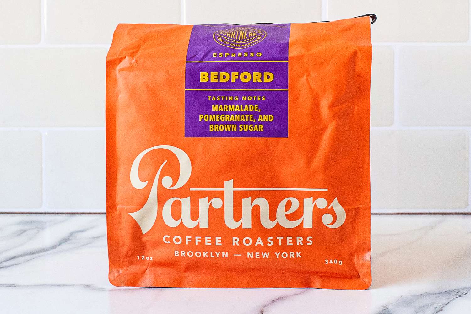 Bag of Bedford espresso coffee from Partners Coffee Roasters, tasting notes include marmalade, pomegranate, and brown sugar