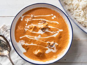Butter chicken in a white bowl