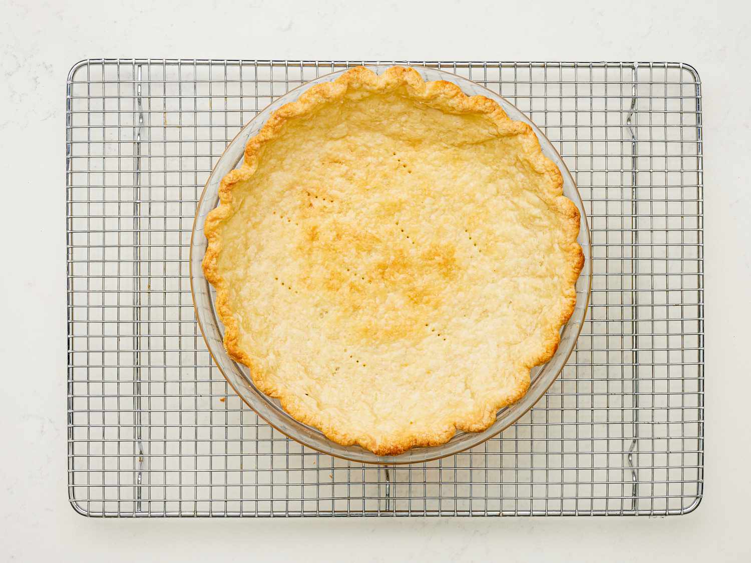 Overhead view of pie crust cooling