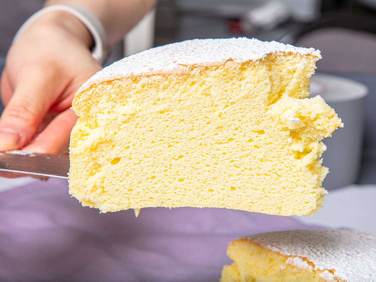 Close-up of a slice of Japanese cheesecake being served on a spatula