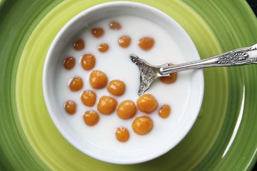 Overhead shot of a bowl of Pumpkin Glutinous Rice Balls in coconut milk