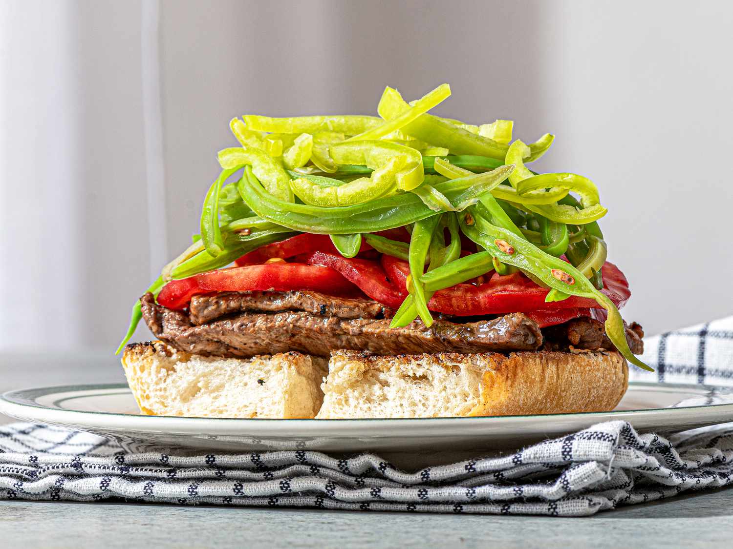 Side view of peppers added on top of greenbeans