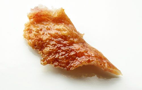 Crisp, cooked pork skin.
