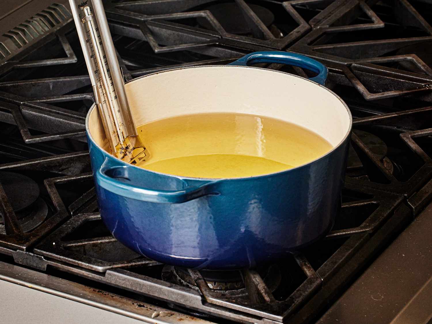 Dutch oven filled with heated oil