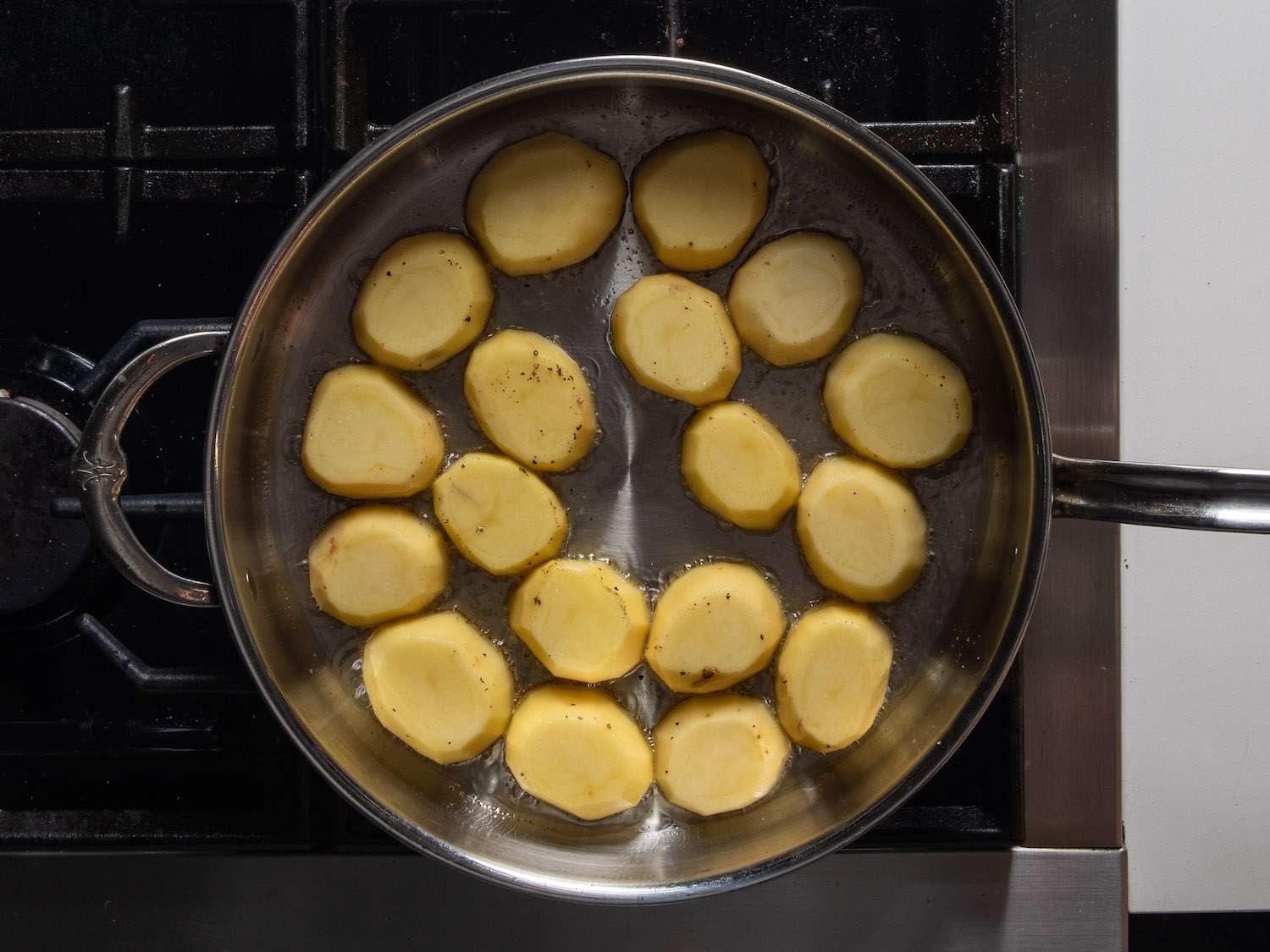 Searing potatoes in a large sautÃ© pan