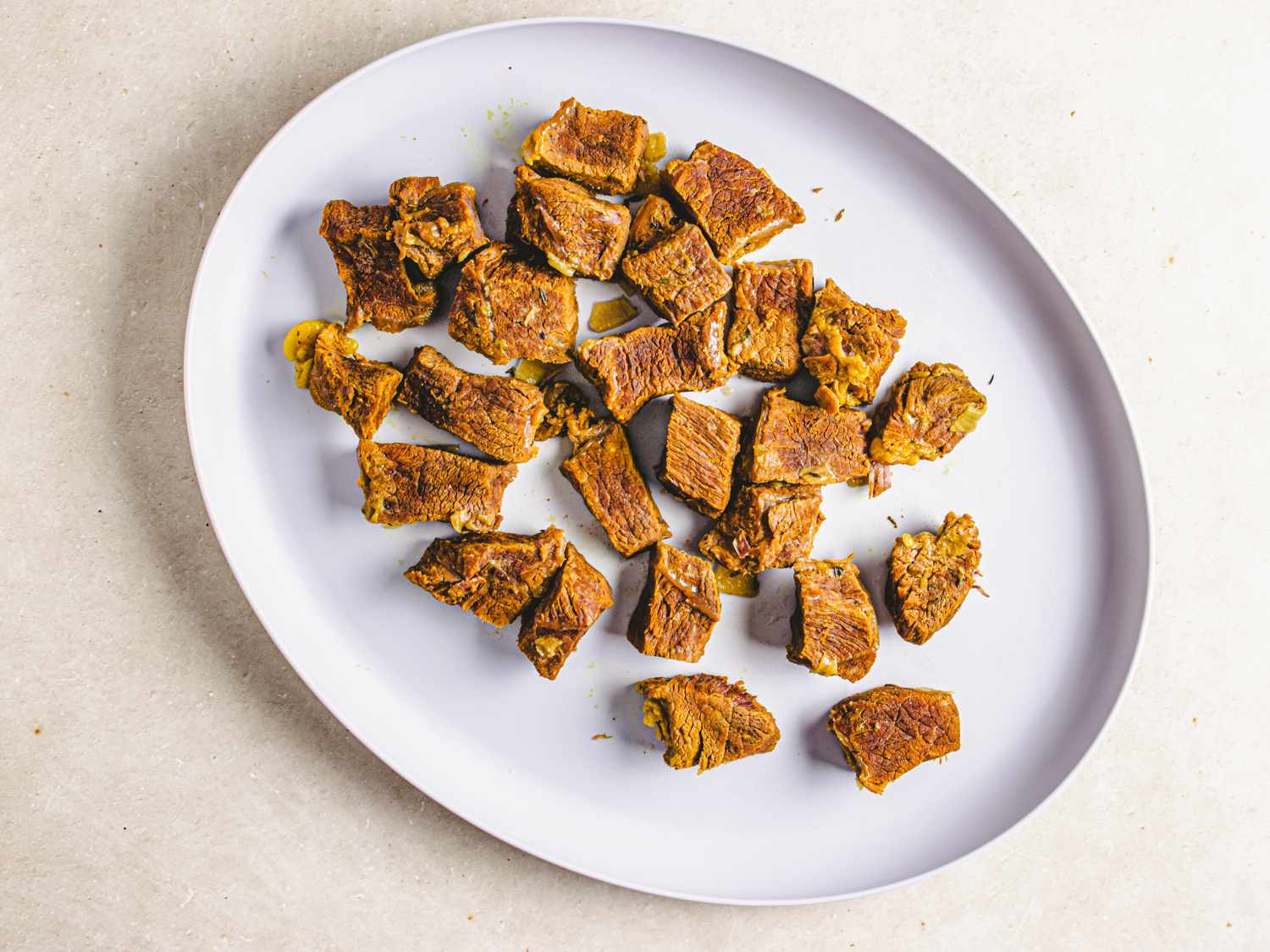 Removed beef on a platter set aside