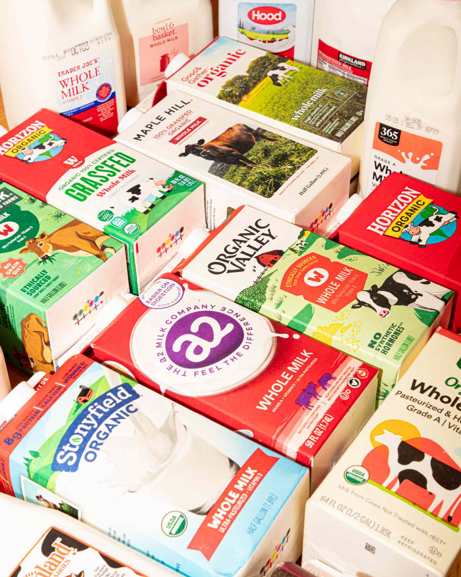 A variety of milk carton brands arranged closely together