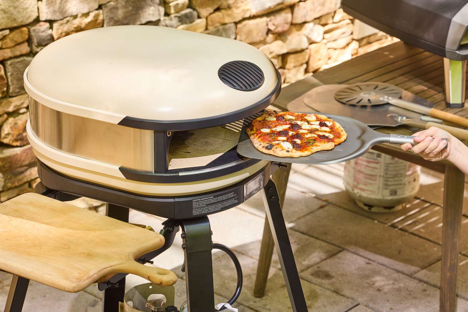 A pizza cooked in the Gozney ARC XL Compact Pizza Oven