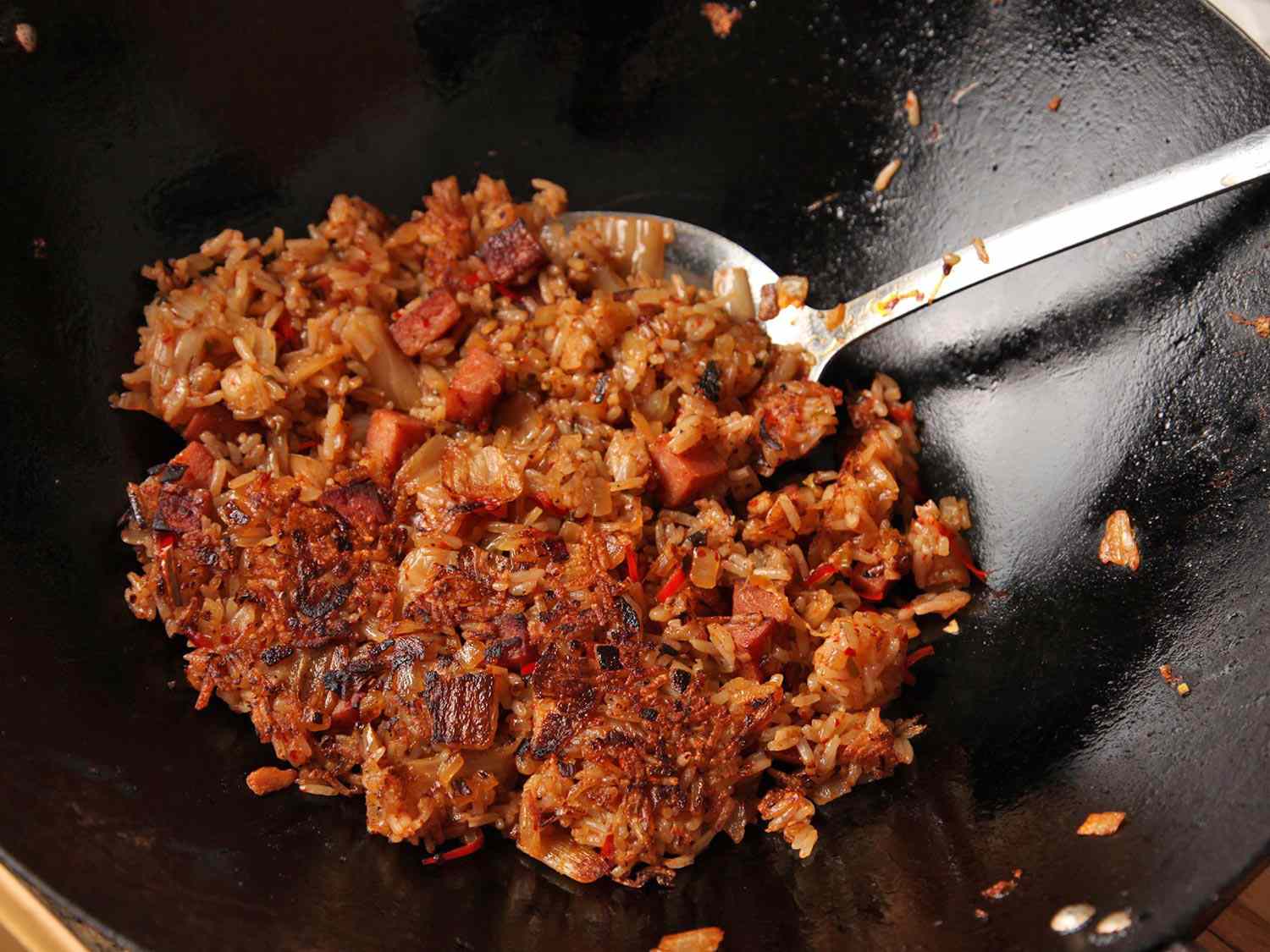 Crispy brown crust on kimchi and spam wok-fried rice.