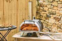 A pizza cooks in the Ooni Karu 2 Pro Multi-Fuel Pizza Oven