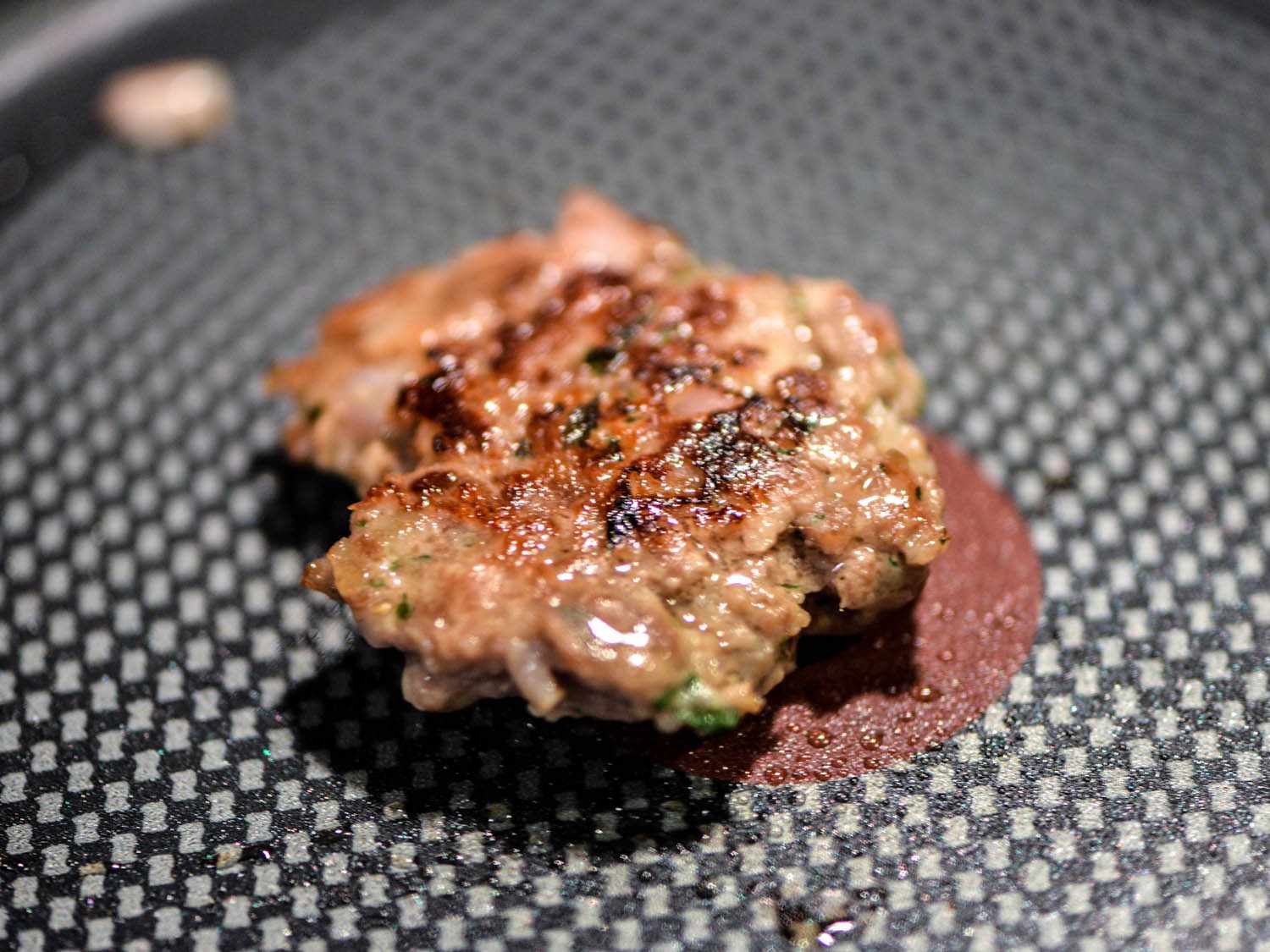 A test patty is cooked in a nonstick skillet.
