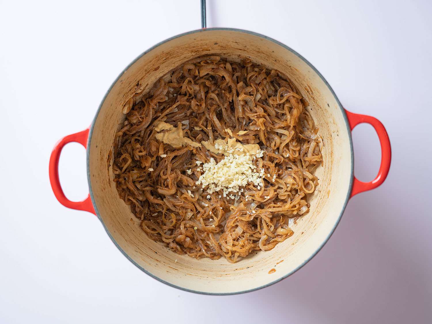 Stewed onions topped with garlic and mustard.