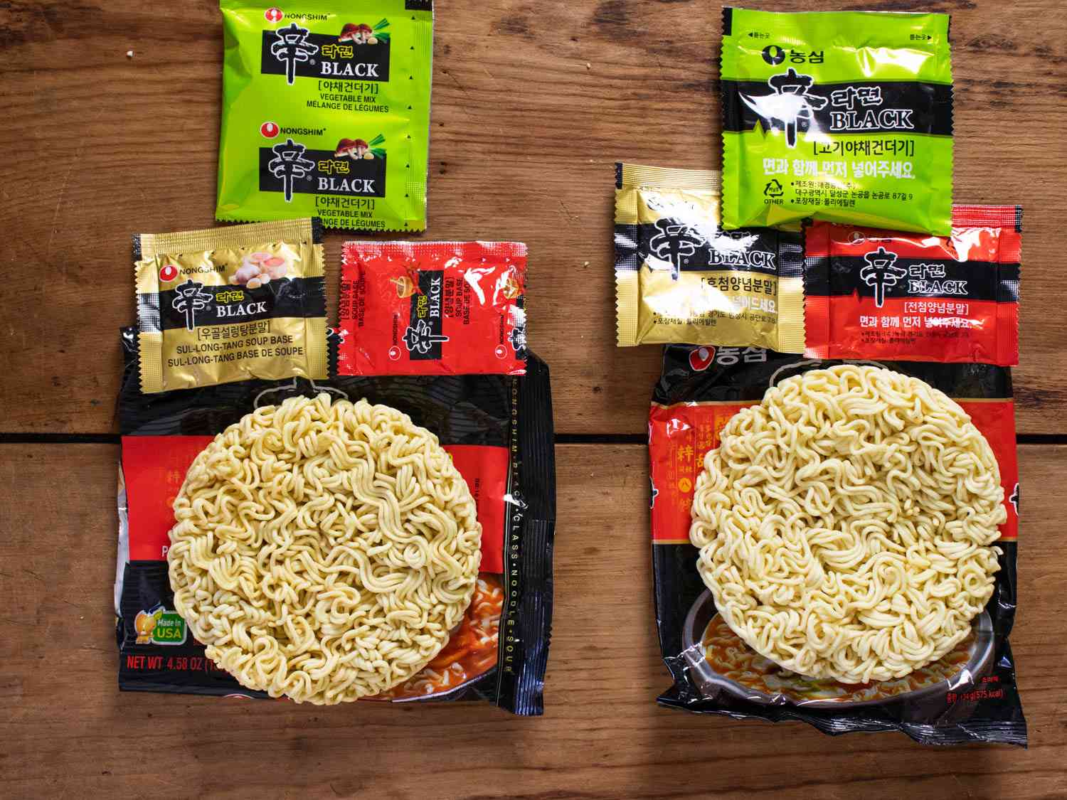Shin Ramyun Black unpackaged with components on display, with Korean version on the right.