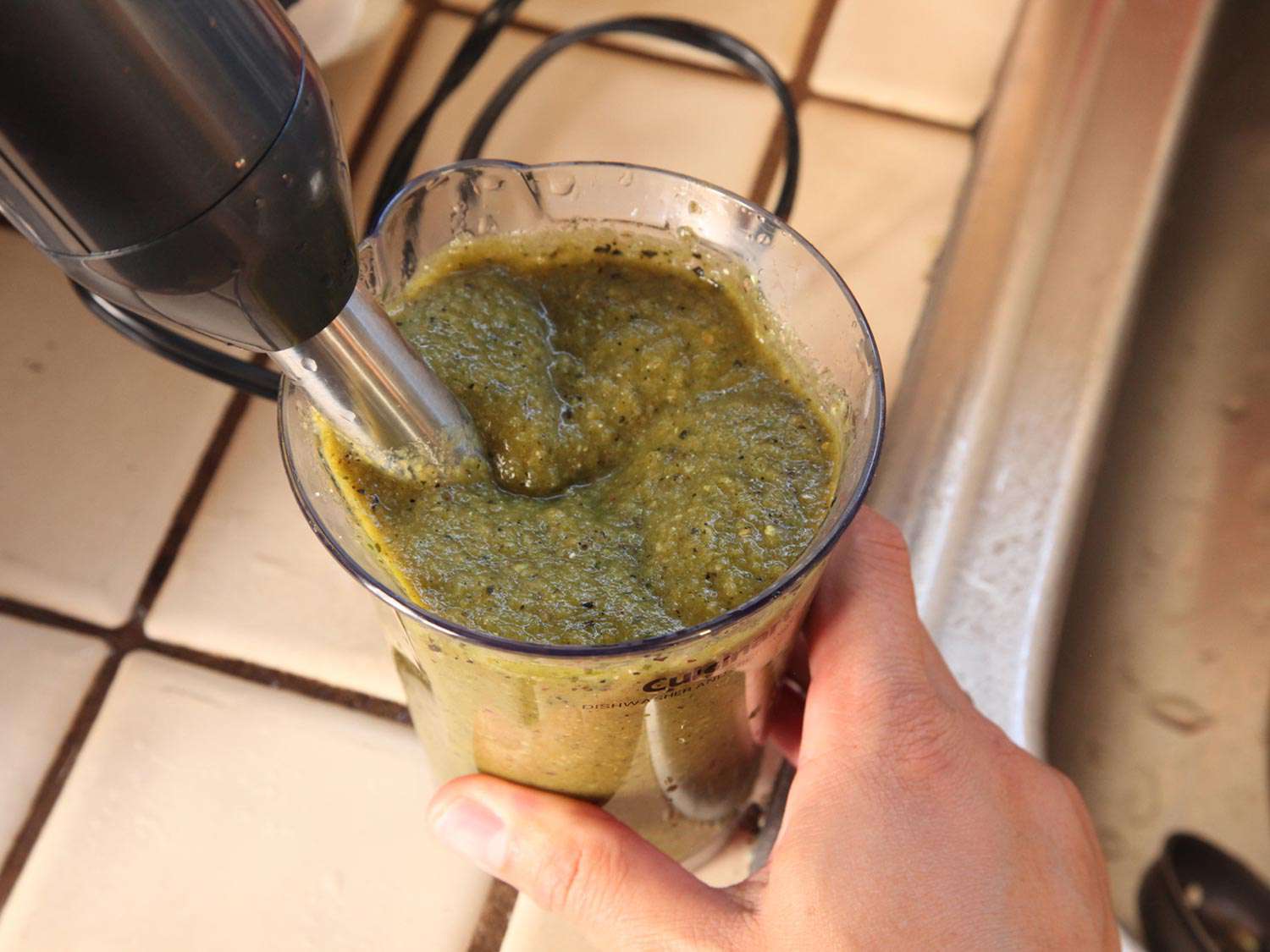 Puréeing chile flesh with an immersion blender.