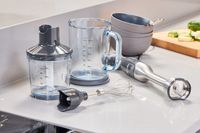 The Breville Control Grip Immersion Blender and accessories on a countertop