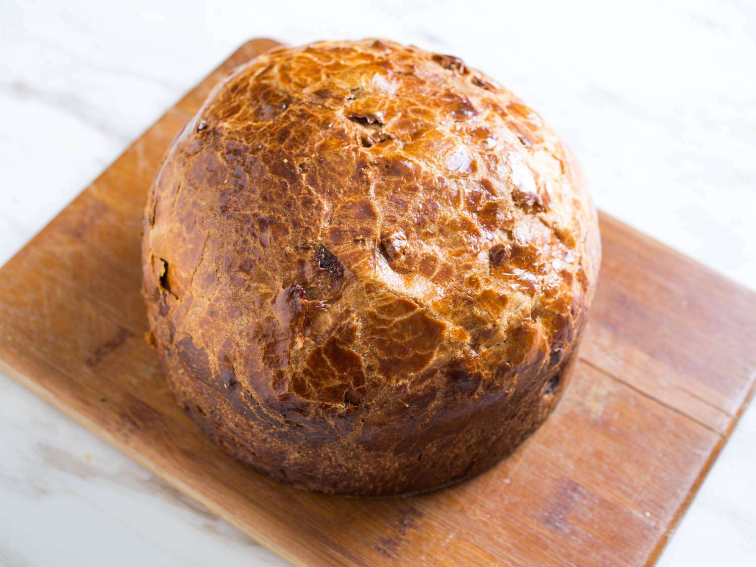 Overhead shot of panettone loaf on wooden board