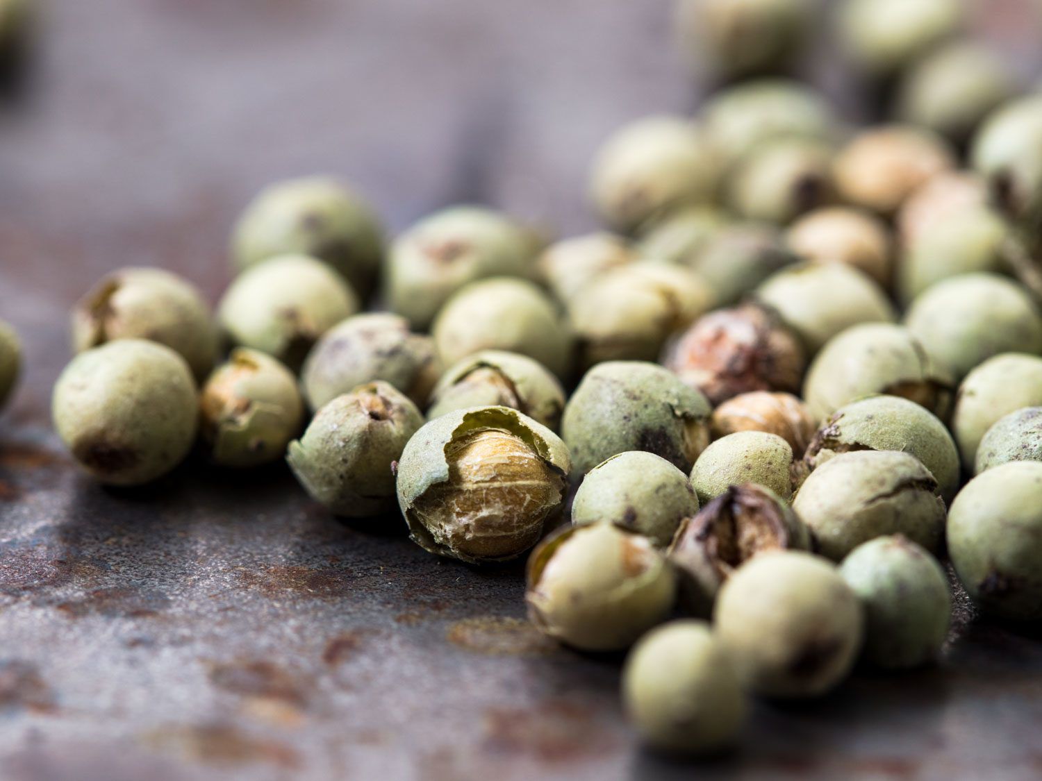 Macro closeup of green peppercorns