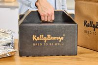 A person holding the KellyBronze Turkey box