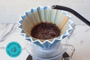 Water being poured into a pour-over coffee device.