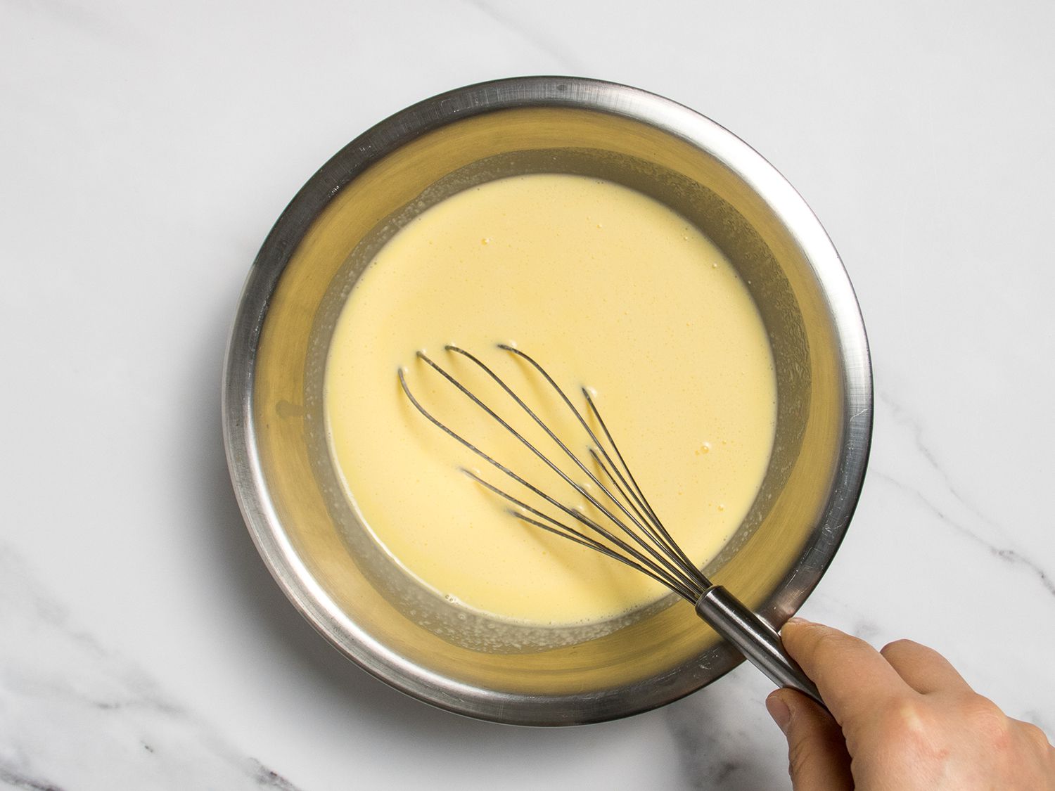 Eggs and cream whisked until smooth and homogenous.