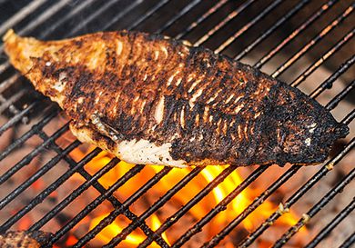 Blackened catfish over fire grill