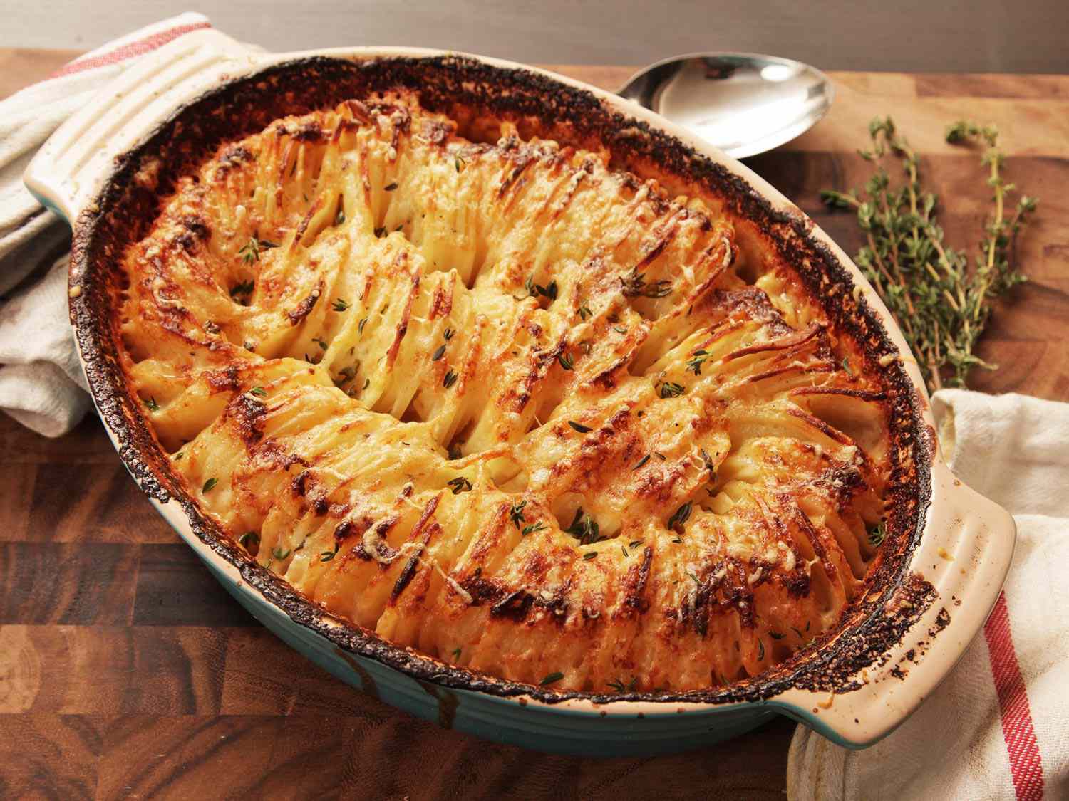Overhead view of hasselback potato gratin in a casserole dish.