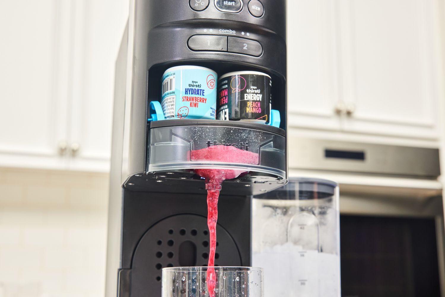 Ninja Thirsti Drink System dispensing a drink into a glass