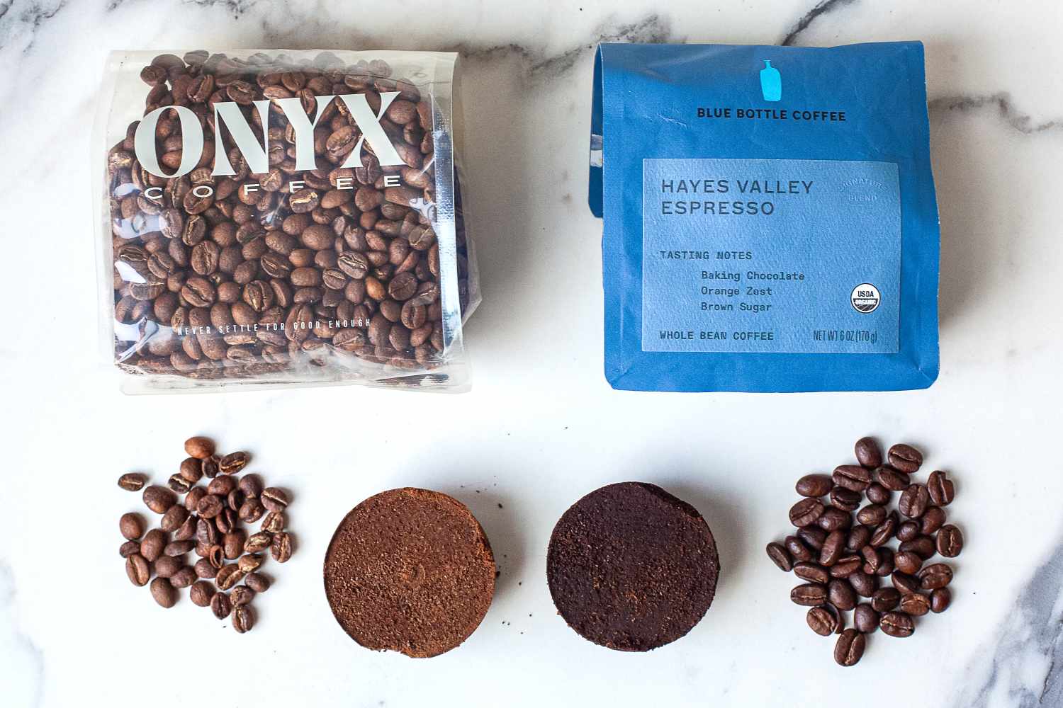 Two coffee brands displayed with coffee beans and compressed coffee grounds