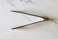 Material Kitchen The Only Tongs on a marble surface