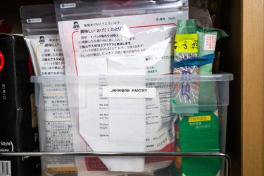 Plastic box filled with containers of non-perishable Japanese pantry ingredients