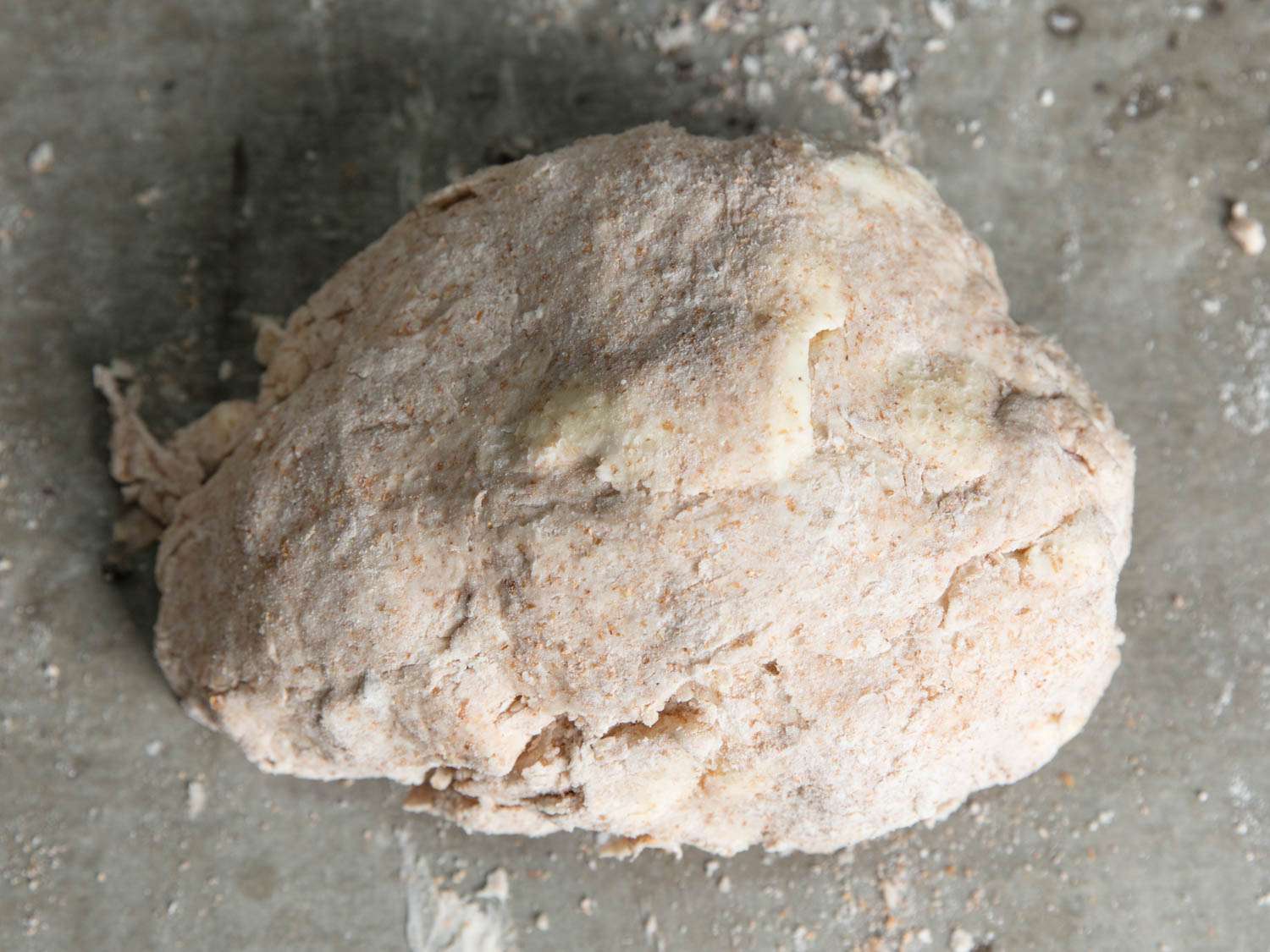 The mixed pie dough, gathered together into a ball.