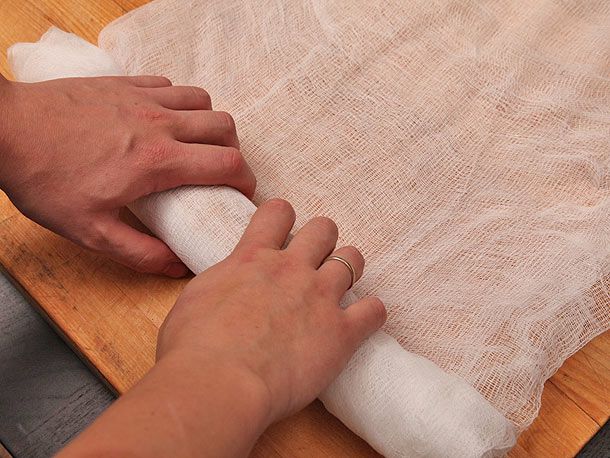 Author wrapping the foie gras in cheesecloth.