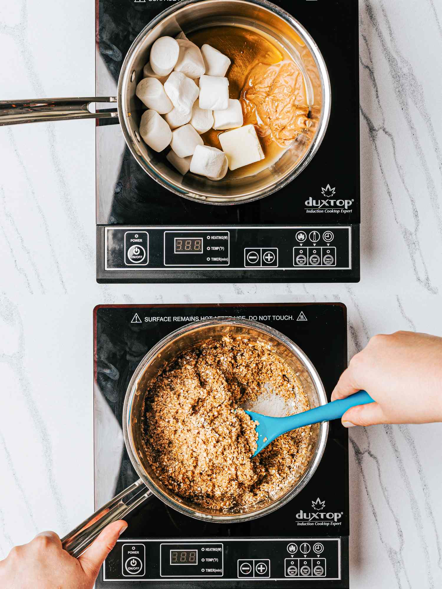 Two stovetop burners with marshmallows and peanut butter melting in one pan and a mixture being stirred in another