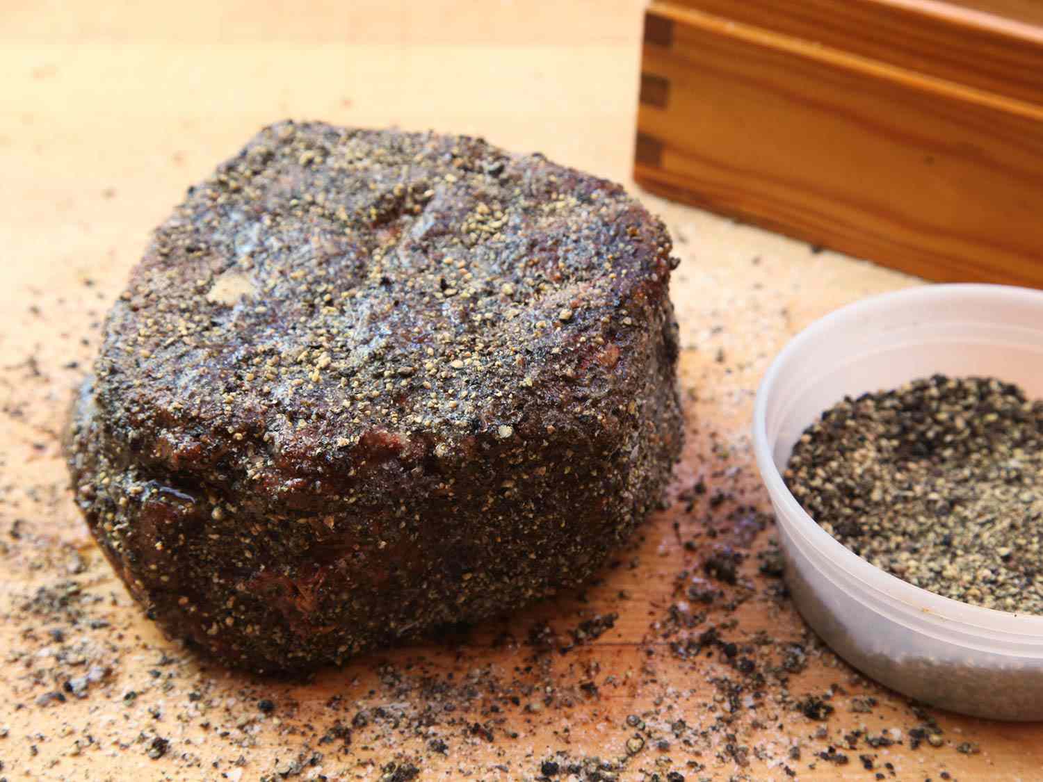 The cooked chuck roast is reseasoned before finishing.