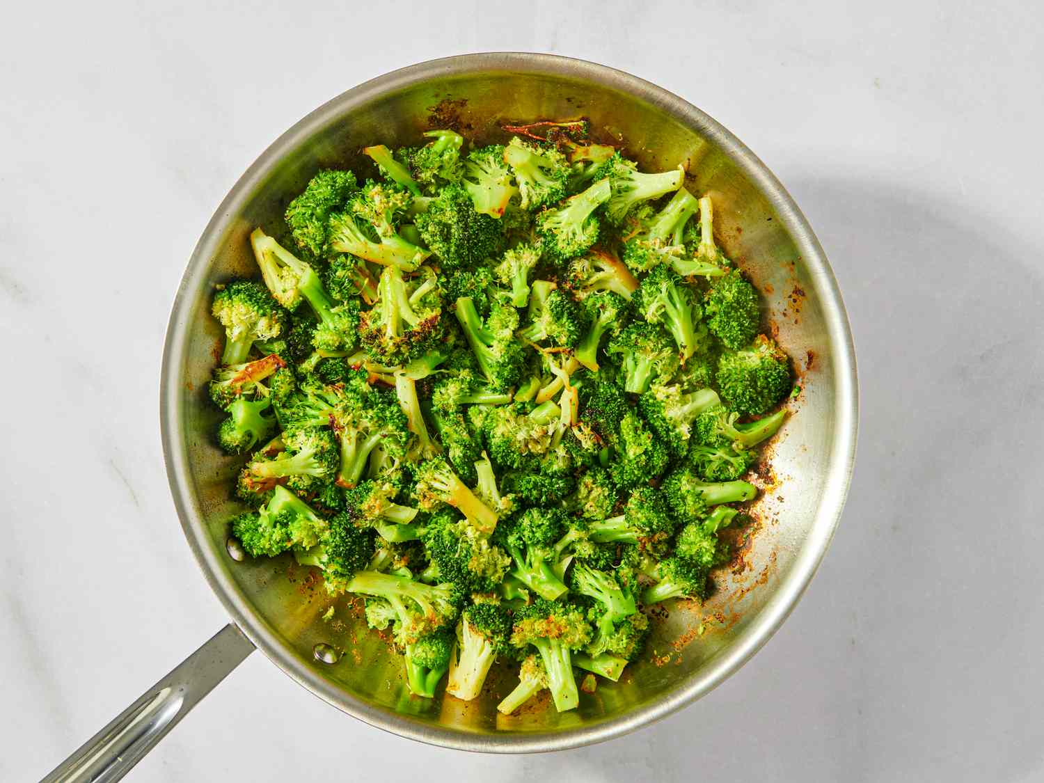 Cooked broccoli florets served in a skillet