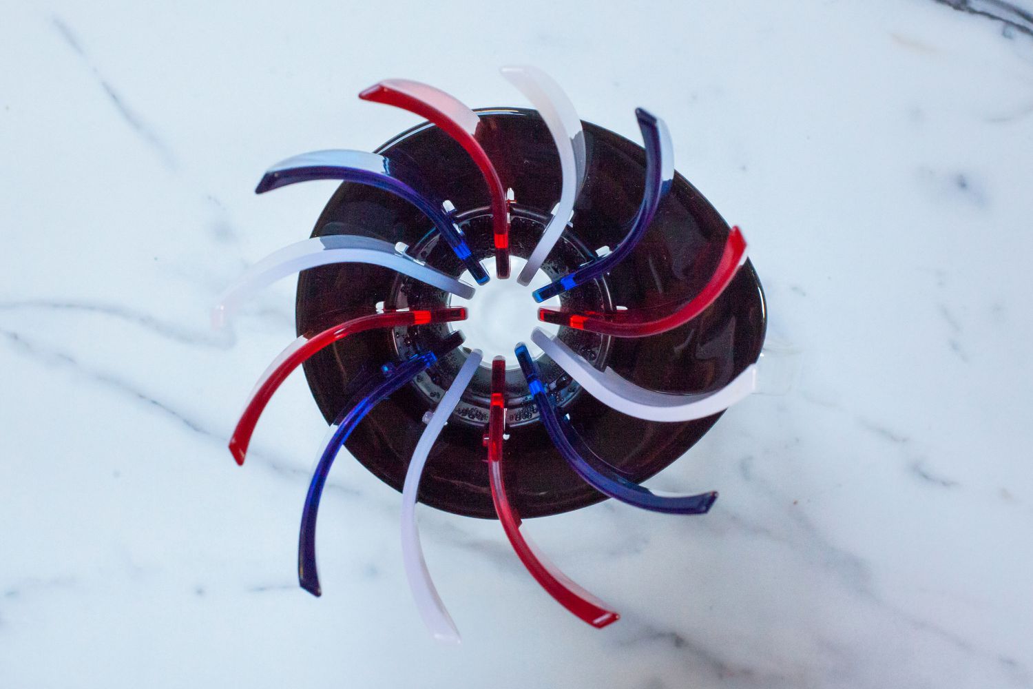 The Hario Suiren pour-over brewer on a marble kitchen countertop.